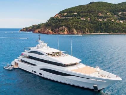 A luxury yacht sailing across crystal-clear waters, offering the perfect balance of adventure, budget-friendly escapes, and luxury travel with Adventure Atlas Global."