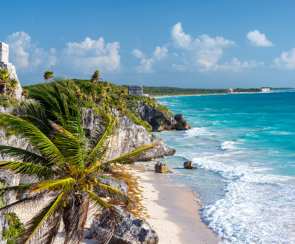 "Scenic view of a beach with ancient Mayan ruins in Tulum, Mexico – A must-visit destination in this Tulum travel guide."