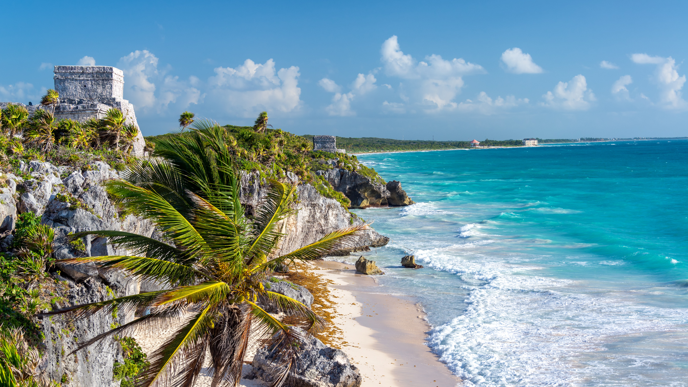 "Scenic view of a beach with ancient Mayan ruins in Tulum, Mexico – A must-visit destination in this Tulum travel guide."