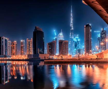 "Stunning night view of Dubai city skyline, featuring the illuminated Burj Khalifa and futuristic skyscrapers."