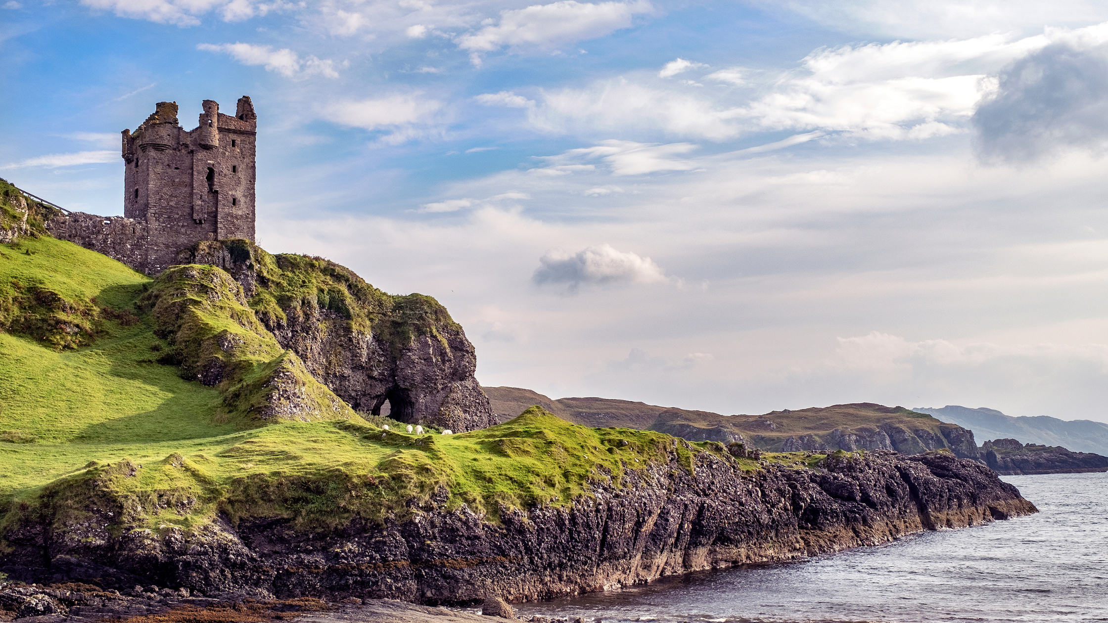 A stunning castle on Scotland’s rugged coastline, showcasing historic architecture and breathtaking ocean views.